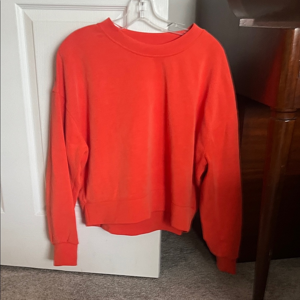 Bright Orange Soft stream Lululemon Sweatshirt size 10.  Like new condition.
